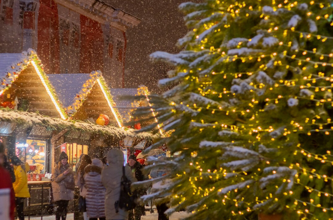 People queuing for mulled wine at a Danish Christmas market stall